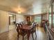 Comfortable dining room with tiled floors, wooden table, and adjacent rooms for easy access at 1393 Russellville Rd, Saint Stephen, SC 29479