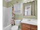 Cozy bathroom featuring a tub-shower combo and a classic vanity with ample storage at 1428 Bloomingdale Ln, Mount Pleasant, SC 29466