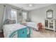 Charming bedroom with two twin beds, floral bedding, and window providing natural light at 1428 Bloomingdale Ln, Mount Pleasant, SC 29466
