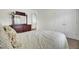 Relaxing bedroom with dresser, mirror, closet, and a comfy bed with floral patterned bedding at 1428 Bloomingdale Ln, Mount Pleasant, SC 29466