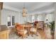 Bright dining area featuring hardwood floors, a round table, and an eye-catching chandelier at 1428 Bloomingdale Ln, Mount Pleasant, SC 29466