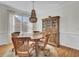 Bright dining room featuring a wooden table, chairs, and hutch, perfect for Gathering meals and entertaining at 1428 Bloomingdale Ln, Mount Pleasant, SC 29466