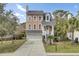 Charming two-story home featuring a welcoming entrance, attached garage, and beautifully landscaped front yard at 1428 Bloomingdale Ln, Mount Pleasant, SC 29466