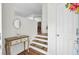 Stylish foyer featuring hardwood floors, elegant console table, and a staircase leading to the upper level at 1428 Bloomingdale Ln, Mount Pleasant, SC 29466