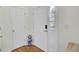 Bright foyer with hardwood floors, white walls, and a view of the front door and closet at 1428 Bloomingdale Ln, Mount Pleasant, SC 29466