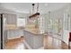 Modern kitchen with a large island, stainless steel appliances, and ample natural light at 1428 Bloomingdale Ln, Mount Pleasant, SC 29466