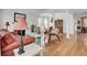 Spacious living room showcasing hardwood floors, fireplace, and abundant natural light from the large window at 1428 Bloomingdale Ln, Mount Pleasant, SC 29466