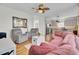 Open living area with hardwood floors and view into the kitchen, perfect for entertaining guests at 1428 Bloomingdale Ln, Mount Pleasant, SC 29466