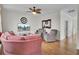 Cozy living room with hardwood flooring, a ceiling fan, comfortable seating, and a decorative mirror at 1428 Bloomingdale Ln, Mount Pleasant, SC 29466