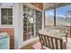 Cozy screened porch area with comfortable seating and access to the home via sliding glass doors at 1428 Bloomingdale Ln, Mount Pleasant, SC 29466
