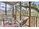Relaxing screened porch with comfortable seating, a bright rug, and serene wooded views at 1428 Bloomingdale Ln, Mount Pleasant, SC 29466