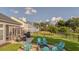 Spacious backyard featuring a patio, fire pit, and lush lawn perfect for outdoor living and entertainment at 144 Back Tee Cir, Summerville, SC 29485