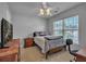 Bright bedroom with a ceiling fan and large window at 144 Back Tee Cir, Summerville, SC 29485