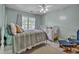 Inviting bedroom featuring a cozy bed, a crib, and a window with natural light at 144 Back Tee Cir, Summerville, SC 29485