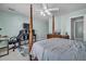 Bedroom with a four-poster bed, a ceiling fan, and a gray patterned rug at 144 Back Tee Cir, Summerville, SC 29485