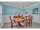 Traditional dining room featuring a chandelier, wood table and chairs, and light blue walls at 144 Back Tee Cir, Summerville, SC 29485