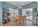 Eat-in kitchen with white dining set, contemporary lighting, and sliding door leading to a porch at 144 Back Tee Cir, Summerville, SC 29485