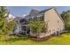 Charming two-story home featuring a welcoming front porch and well-manicured lawn and a two car garage at 144 Back Tee Cir, Summerville, SC 29485