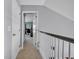 Hallway with carpet, a white handrail, and doors leading to various rooms at 144 Back Tee Cir, Summerville, SC 29485