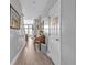 Welcoming hallway features wood-look tile floors and views of the living room and staircase at 144 Back Tee Cir, Summerville, SC 29485