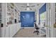 Charming home office features built-in bookshelves, desk space, and wood-look tile floors at 144 Back Tee Cir, Summerville, SC 29485