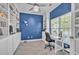 Charming home office features built-in bookshelves, desk space, and wood-look tile floors at 144 Back Tee Cir, Summerville, SC 29485