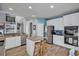 Kitchen with white cabinets, stainless appliances, and an island with bar stool seating at 144 Back Tee Cir, Summerville, SC 29485