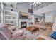 Spacious living room with fireplace, bookshelves and stairs to second floor at 144 Back Tee Cir, Summerville, SC 29485
