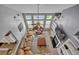 Bright living room boasts high ceilings, a ceiling fan, large windows and modern décor at 144 Back Tee Cir, Summerville, SC 29485