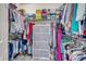 Spacious walk-in closet features ample clothing racks, shelving, and storage containers at 144 Back Tee Cir, Summerville, SC 29485