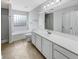 Well-lit bathroom with a shower-tub combo, a large mirror, and tile floors at 159 Antebellum Way, Summerville, SC 29483