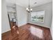 Bright dining room with hardwood floors, a chandelier, and backyard views of the pool at 159 Antebellum Way, Summerville, SC 29483