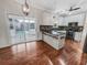 Modern kitchen with white cabinets, mosaic backsplash, and stainless steel appliances, next to a patio with a pool at 159 Antebellum Way, Summerville, SC 29483