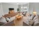 Bright living room with hardwood floors, a bay window, and contemporary furnishings at 159 Antebellum Way, Summerville, SC 29483