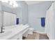 Well-lit bathroom featuring a white vanity, matching toilet, and a shower with a white curtain at 1600 Long Grove Dr # 626, Mount Pleasant, SC 29464