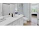 Well-lit bathroom with white vanity, contemporary fixtures, and tiled flooring at 1600 Long Grove Dr # 626, Mount Pleasant, SC 29464