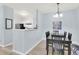Open concept dining area with modern lighting and seamless flow to the kitchen at 1600 Long Grove Dr # 626, Mount Pleasant, SC 29464
