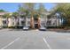 Apartment building featuring parking spaces in front and mature trees surrounding the building at 1600 Long Grove Dr # 626, Mount Pleasant, SC 29464