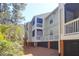 Exterior of an apartment complex with multiple units and balconies surrounded by trees at 1600 Long Grove Dr # 626, Mount Pleasant, SC 29464