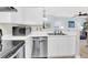 Well-lit kitchen featuring white cabinetry and modern appliances, with an open layout at 1600 Long Grove Dr # 626, Mount Pleasant, SC 29464