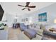 Comfortable living room with a ceiling fan, sofa, and artwork provides a relaxing space at 1600 Long Grove Dr # 626, Mount Pleasant, SC 29464