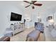 Open-concept living area with a ceiling fan, television, and light, airy decor at 1600 Long Grove Dr # 626, Mount Pleasant, SC 29464