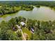 Aerial shot of a home and lake surrounded by lush green trees at 173 Paddle Boat Way, Summerville, SC 29485