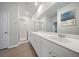 Bathroom featuring double sinks, white cabinets, and a glass-enclosed shower at 173 Paddle Boat Way, Summerville, SC 29485