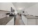Open-concept kitchen with granite countertops, stainless steel appliances, and a view into the adjacent dining area at 173 Paddle Boat Way, Summerville, SC 29485