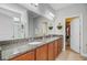Bathroom boasts double sinks, granite countertops, and a walk-in shower; convenient access to walk-in closet at 1807 Chauncy'S Ct, Mount Pleasant, SC 29466