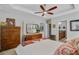 Comfortable bedroom showcasing wood furniture and a view into the ensuite bathroom for added convenience at 1807 Chauncy'S Ct, Mount Pleasant, SC 29466