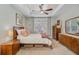 Bright bedroom featuring a ceiling fan, neutral walls, and wood furniture for a comfortable retreat at 1807 Chauncy'S Ct, Mount Pleasant, SC 29466