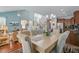 Open-concept living and dining area with vaulted ceiling and seamless flow to kitchen at 1807 Chauncy'S Ct, Mount Pleasant, SC 29466