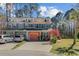 Charming multi-colored townhouse with dormer windows, a front lawn, and a paved driveway at 1807 Chauncy'S Ct, Mount Pleasant, SC 29466